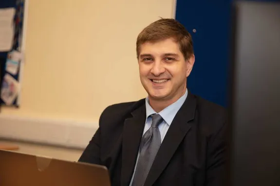 Christian Kaunert wearing a suit and smiling at the camera