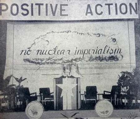 A black and white illustration that shows a nuclear explosion and reads ''positive action'' ''no nuclear imperialism''