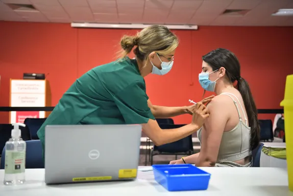Student nurse vaccinates.JPG