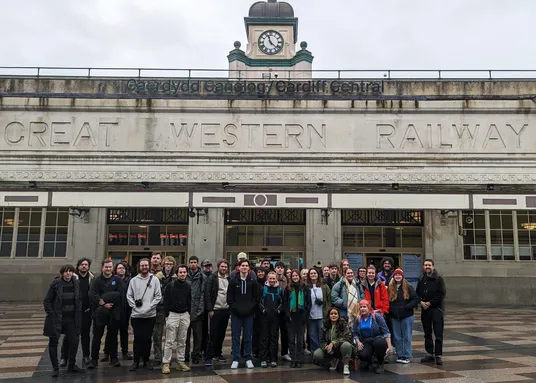 A large group of people outside a train station