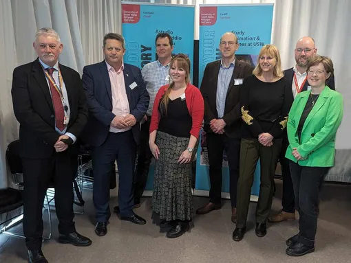 Members of the Senedd’s Culture, Communications, Welsh Language, Sport, and International Relations Committee with colleagues from USW.