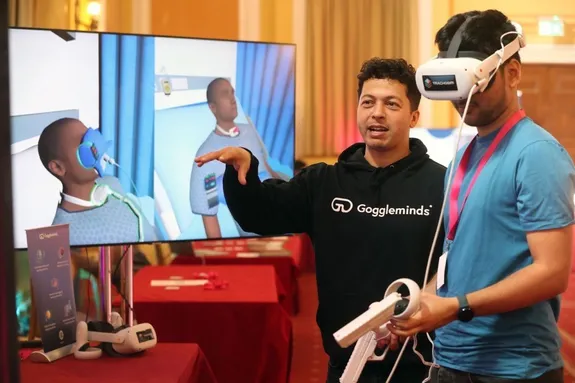 Goggleminds founder Azize Naji operating the specialist VR headsets