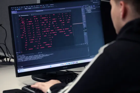 A student using a computer.