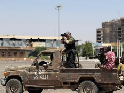 Photojournalist Ivor Prickett taking photos in Sudan