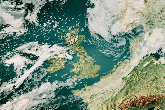 A satellite image of the British Isles, with cloud covering parts of the land but with a clear view of Wales