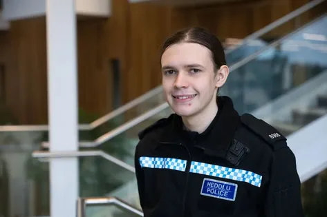 Professional Policing graduate, Layla, poses for a profile picture whilst wearing their South Wales police uniform