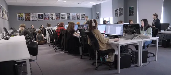 still from Computer Animation course video - students working at computers in a classroom