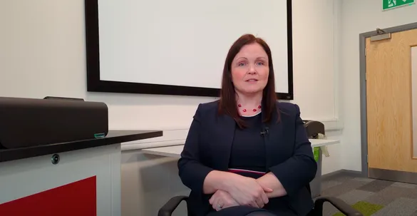 Rachel Elias-Lee sitting in an office facing the camera while being interviewed