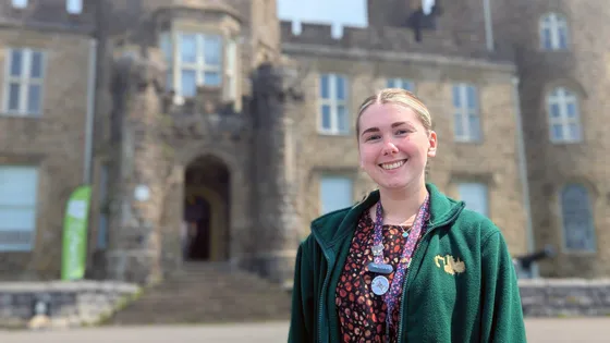 History graduate Charlotte Barry stands outside Cyfarthfa Castle