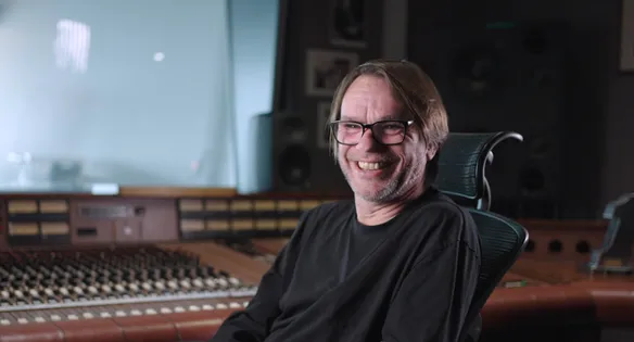 Staff smiling in music studio