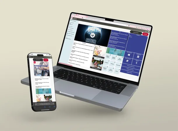 a mobile phone and a laptop displaying the unilife website on screen