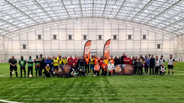 usw walking football tournament participants standing on usw sport park pitch