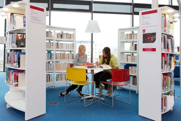 two students sitting at a study space in newport library