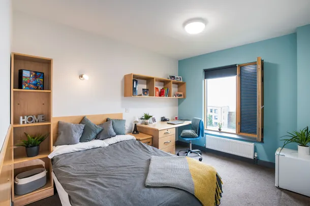 A bright double bedroom at a Pontypridd accommodation block.