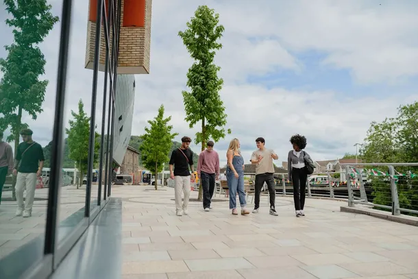 5 students walking through town