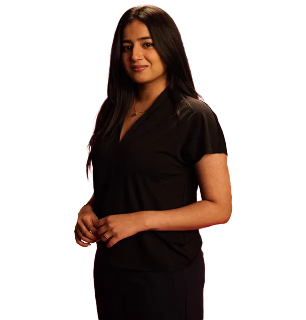 Business student, Aakshi, stood smiling at the camera.