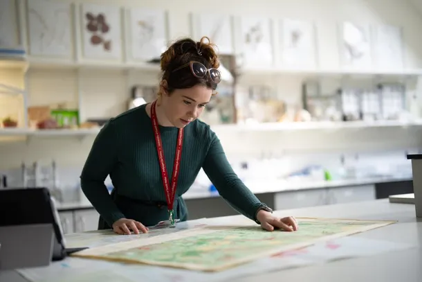 Biological Sciences Wildlife Ecology Researcher studying a map