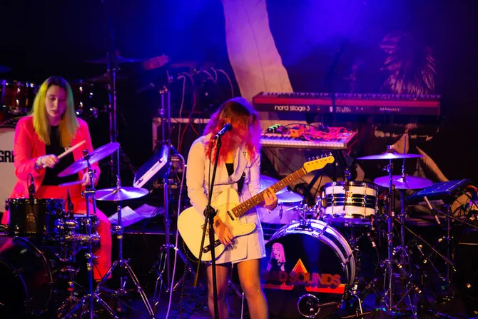 Students performing on stage at the University's Immersed Festival.