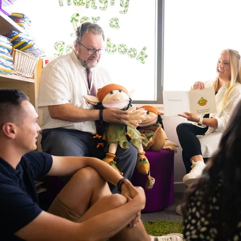 Education students using puppets and reading books at Newport campus