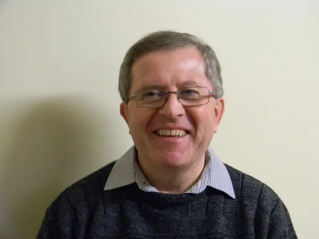Philip Charlesworth smiles for profile shot