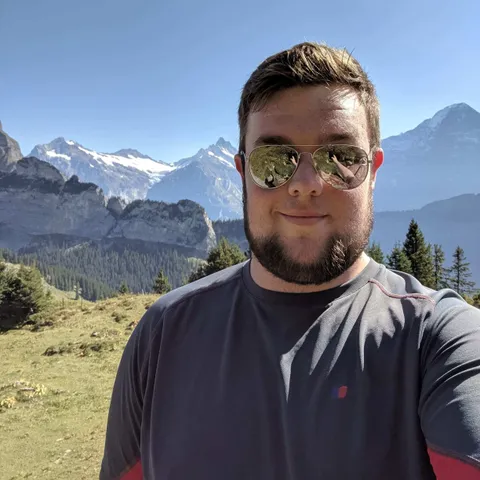 James Robinson, Lead Systems and Design engineer for USW Rocketry society poses for a selfie on a sunny day