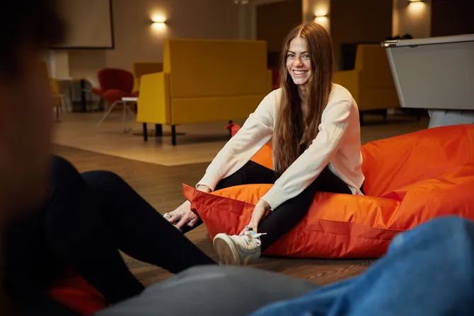 A student sat on beanbags in the accommodation hub.