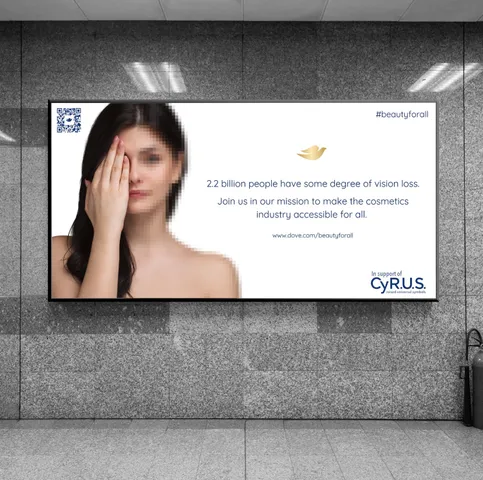 An example of student work that shows a billboard campaign inspired by the brand Dove. It shows a woman with long brown hair, covering her eye with the other half of her face pixelated. The text reads 
