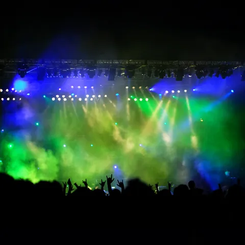 A stage with blue and green lights