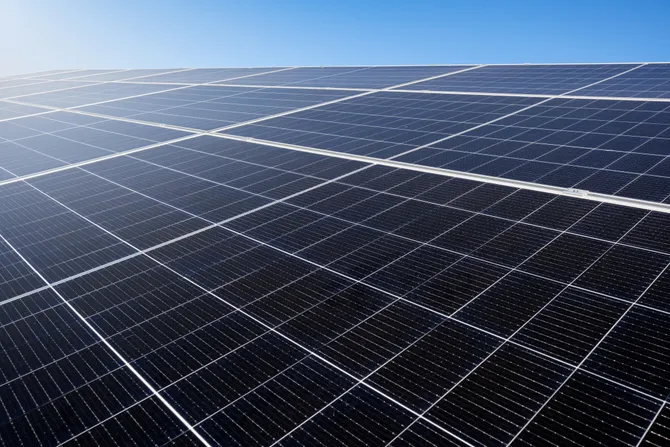 Solar panels and a blue sky.