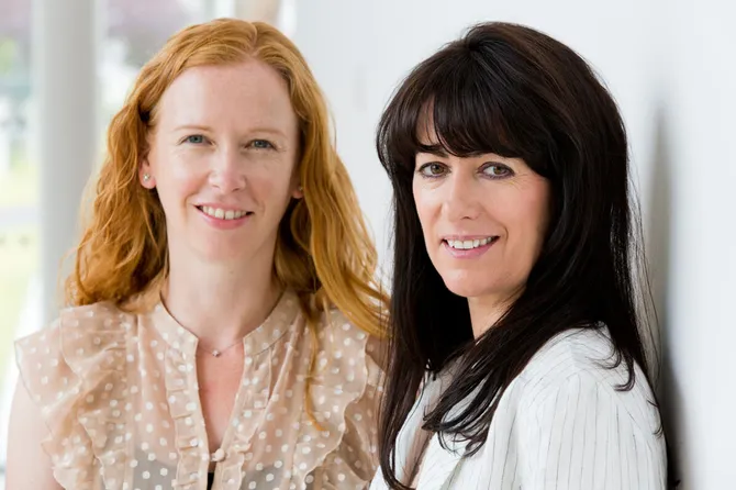 Professors Katy Holloway and Fiona Brookman, smiling directly into camera