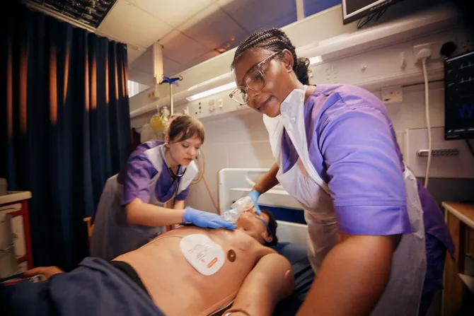 Two nursing students working in the simulation centre