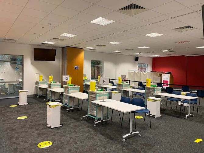 Multiple numbered vaccination stations for Cwm Taf Morgannwg University Health Board Covid-19 vaccination hub