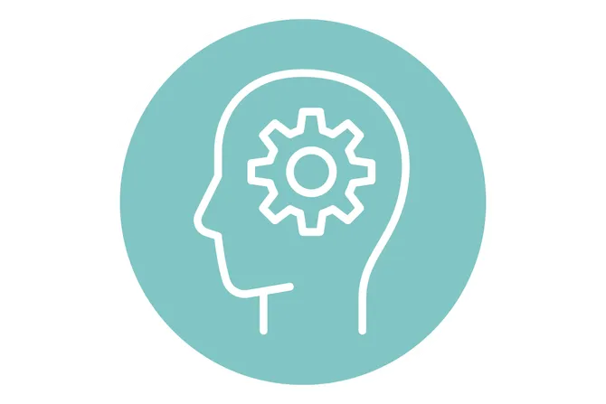 A blue illustrated icon of the outline of a head with a cog in the middle.
