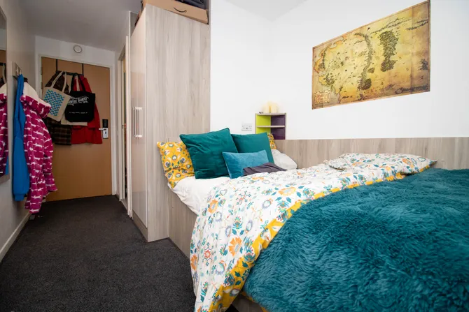view of bed and doorway in accommodation room