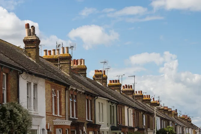 a row of terrace houses showing the blue sky