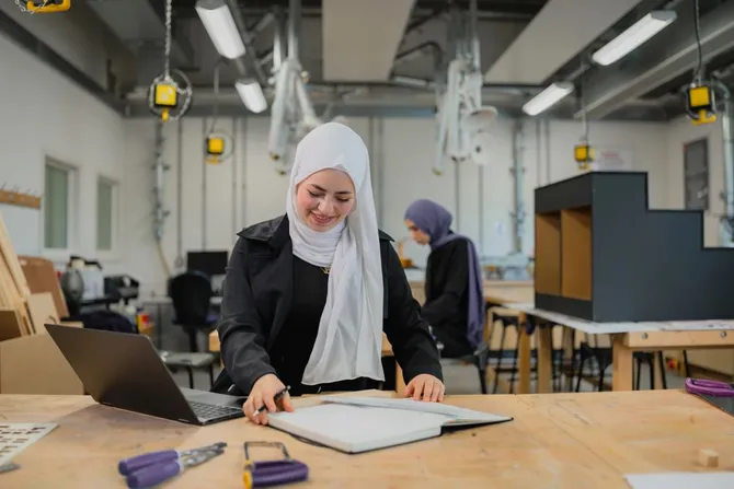 Interior design student working in campus workshop