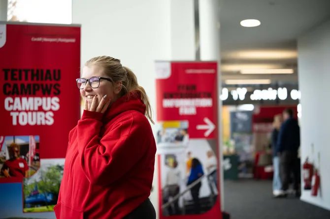 A student ambassador smiling at an Open Day.