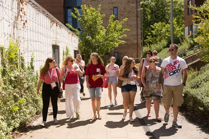 A student ambassador touring the Newport campus with a group of open day visitors.