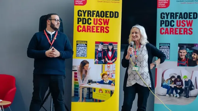 Two members of staff speaking at usw enterprise event