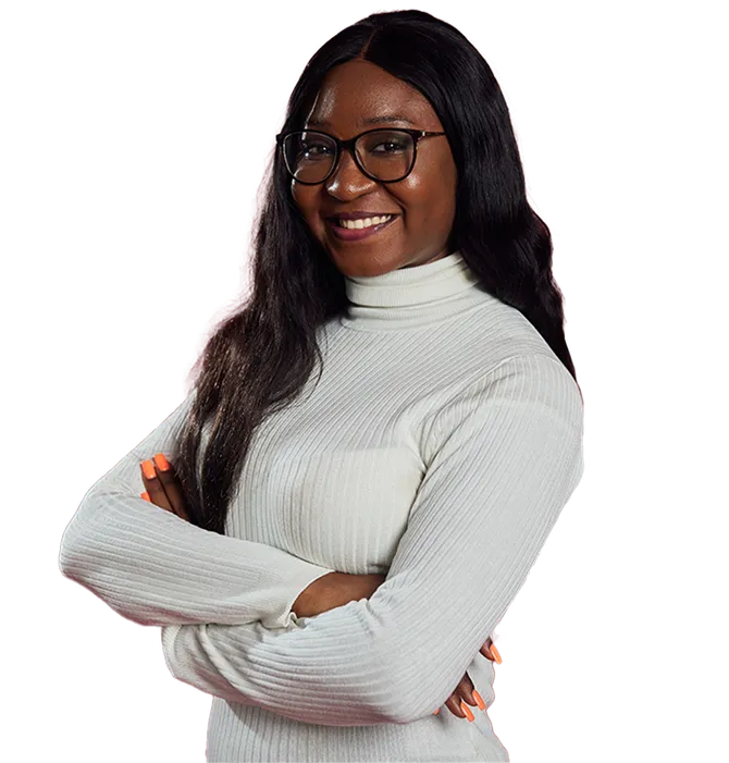 A cut out image of Joelle, smiling at the camera with her arms folded.
