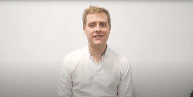 Lecturer talking to camera