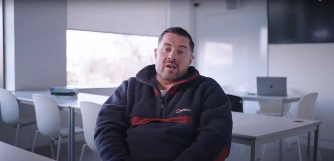 Advertising lecturer talking to camera