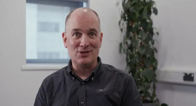 Lecturer talking to camera