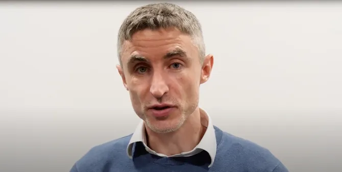 Lecturer talking to camera