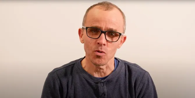 Lecturer talking to camera