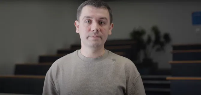 Lecturer talking to camera