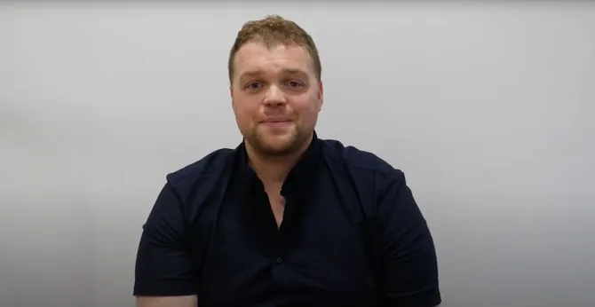 Lecturer talking to camera