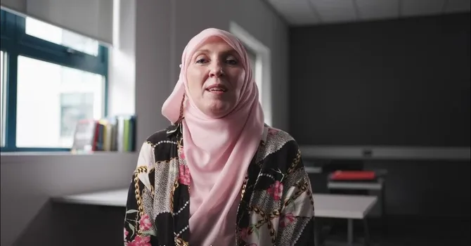 Lecturer talking to camera