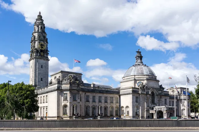 City Hall in Cardiff against a blue sky with clouds