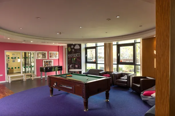 Communal area of the student village with a pool table